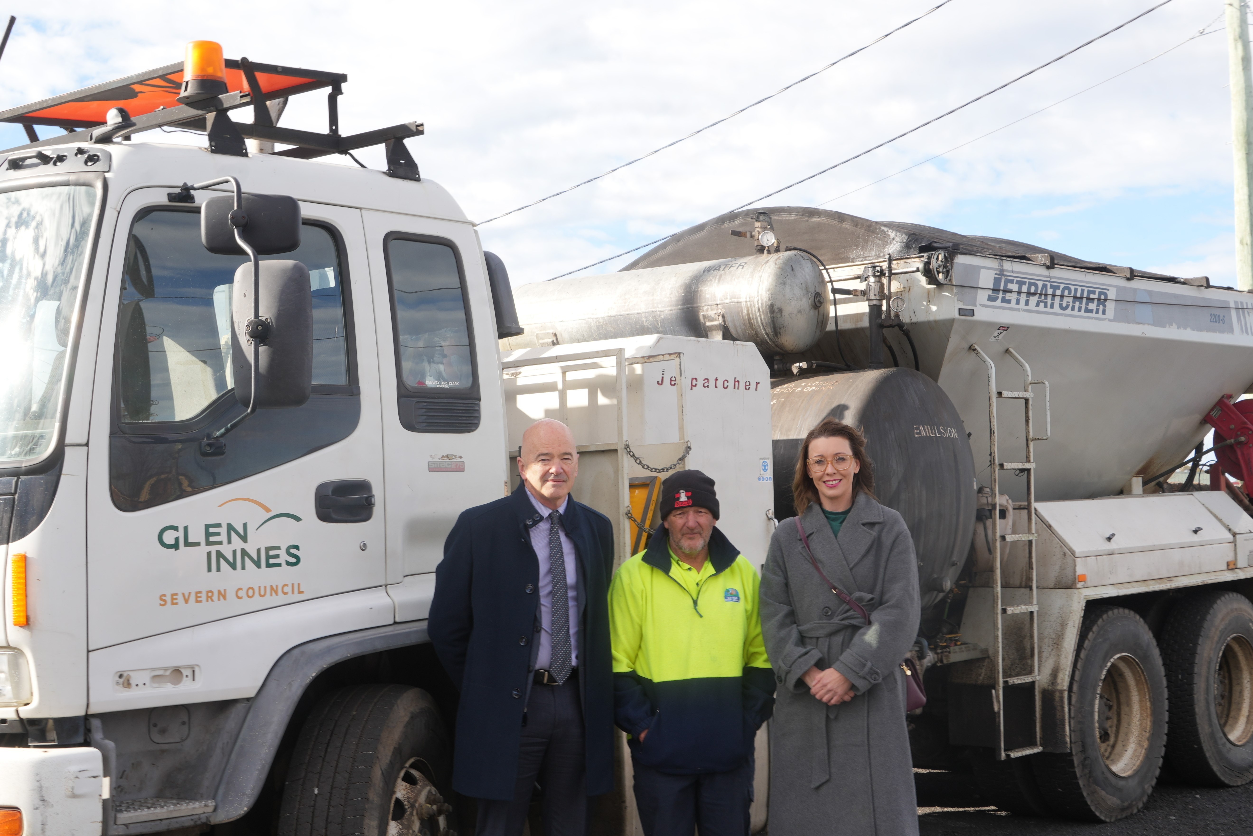 Stephen Crabbe with the Mayor and General Manager, pictured with Council’s jetpatcher truck